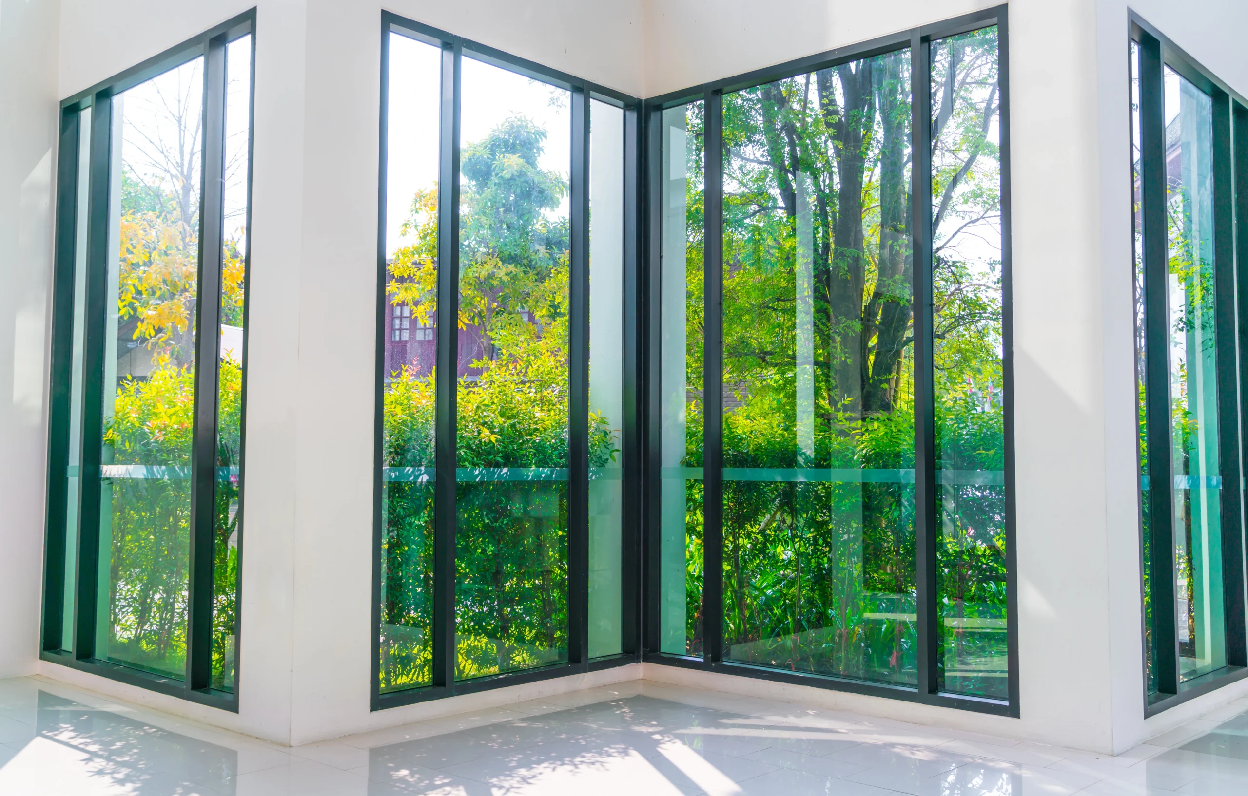 glass window overlooking green g