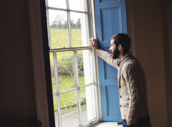 man looking through window (1)