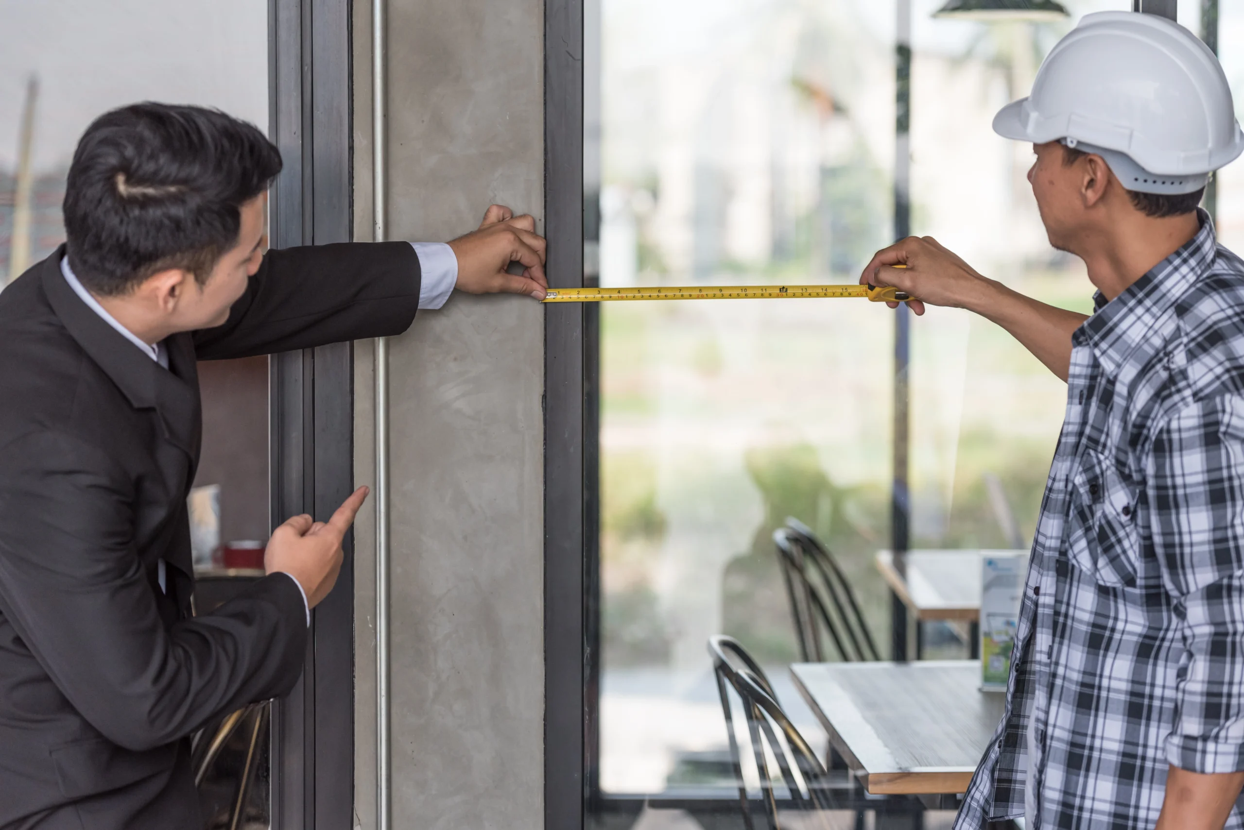 employer foreman measuring glass